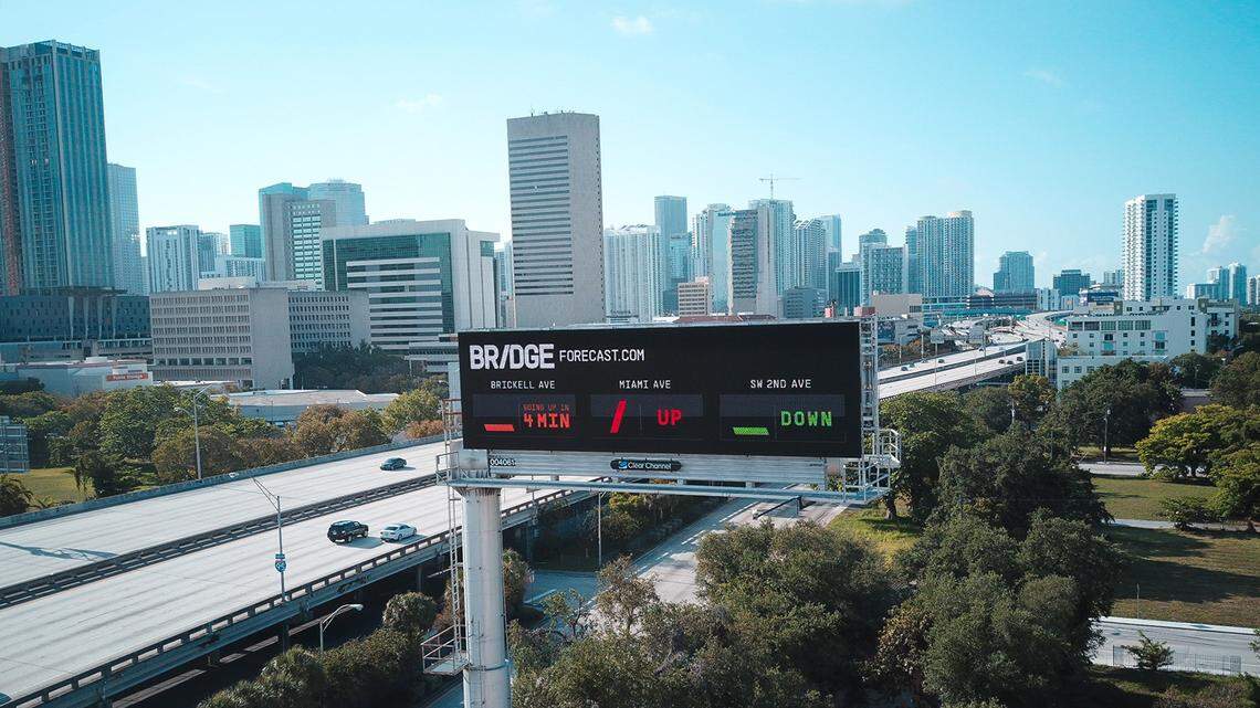 A billboard advertising the website www.bridgeforecast has gone up next to Interstate 95 before the Southwest Eighth Street exit. The website offers predictions about when three bridges over the Miami River will be going up.