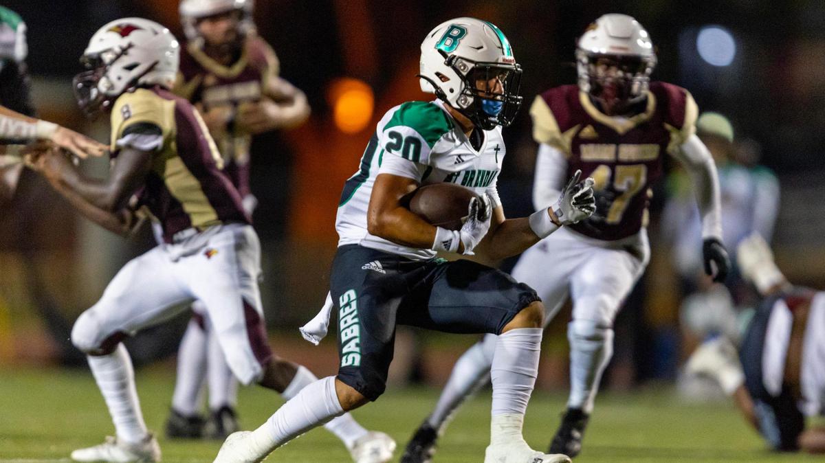 Saint Brendan running back Geovanni Tobon (20) runs the ball during a high school football game against Miami Springs in Miami, Florida, on Friday, September 29, 2023.