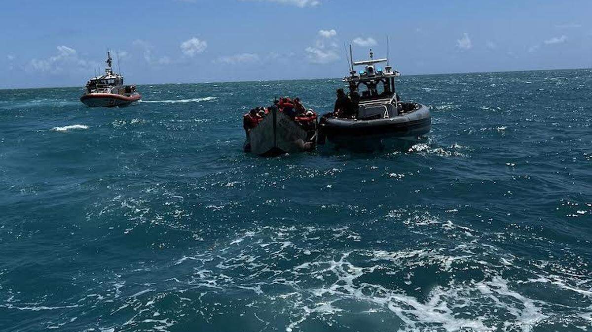 U.S. Coast Guard crews come up to a migrant boat off the Lower Keys Wednesday, April 5, 2023.
