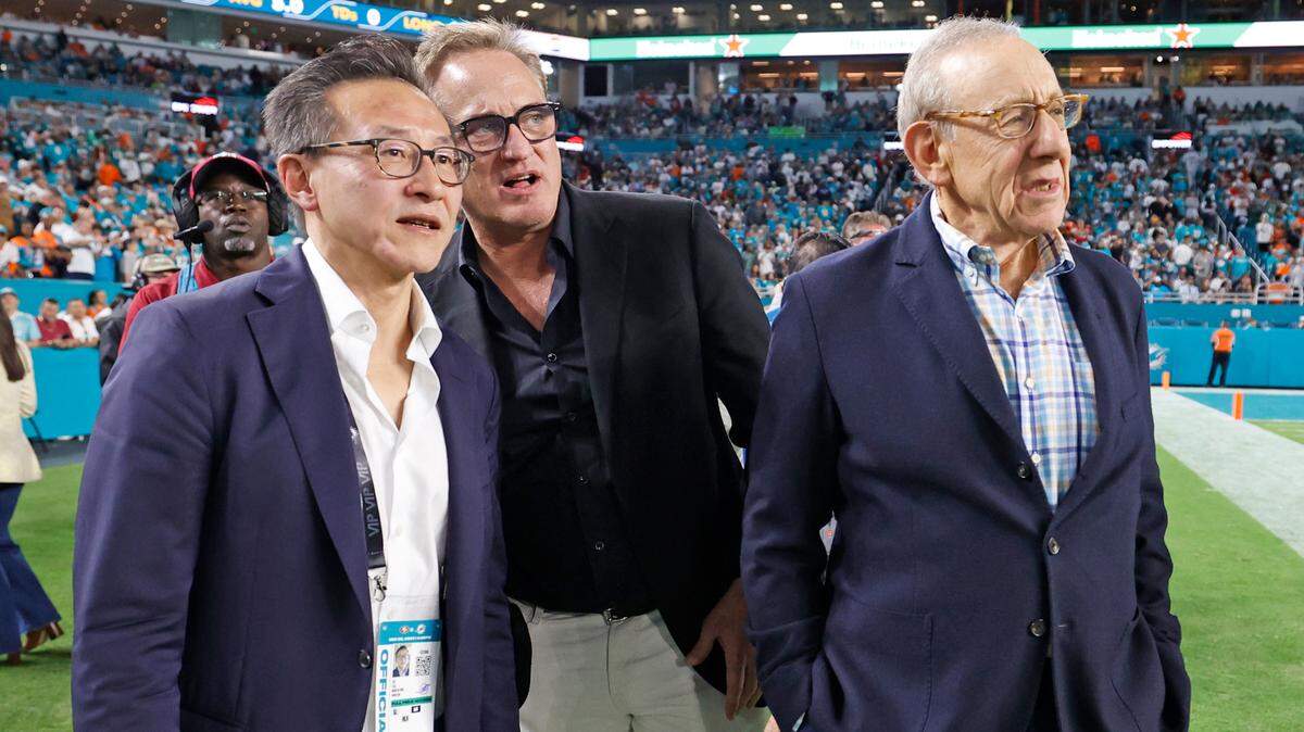 Joe Tsai, already an investor in the NBA, WNBA, MLS and two pro lacrosse leagues, is now part owner of the NFL’s Miami Dolphins, Miami Dolphins Vice President, President & CEO Tom Garfinkel, and Owner Stephen Ross, watch the final moments before the Dolphins defeat the San Francisco 49ers in their NFL football game at Hard Rock Stadium in Miami Gardens, Florida, on Sunday, December 22, 2024.