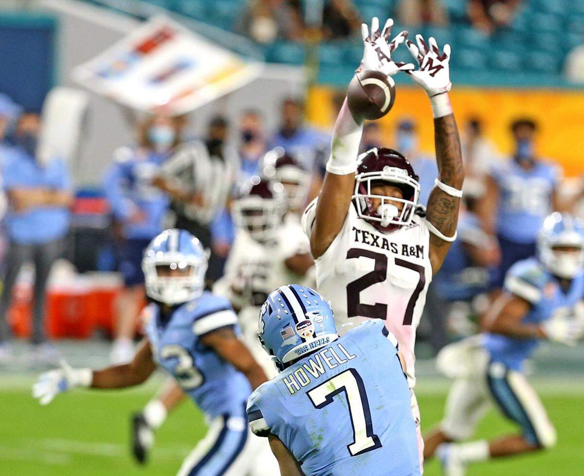 Texas A&M Antonio Johnson (27) blocks North Carolina Tar Heels quarterback Sam Howell pass in the fourth quarter in the Capital One 2021 Orange Bowl at Hard Rock Stadium in Miami Gardens, Florida, Saturday, January 2, 2021.
