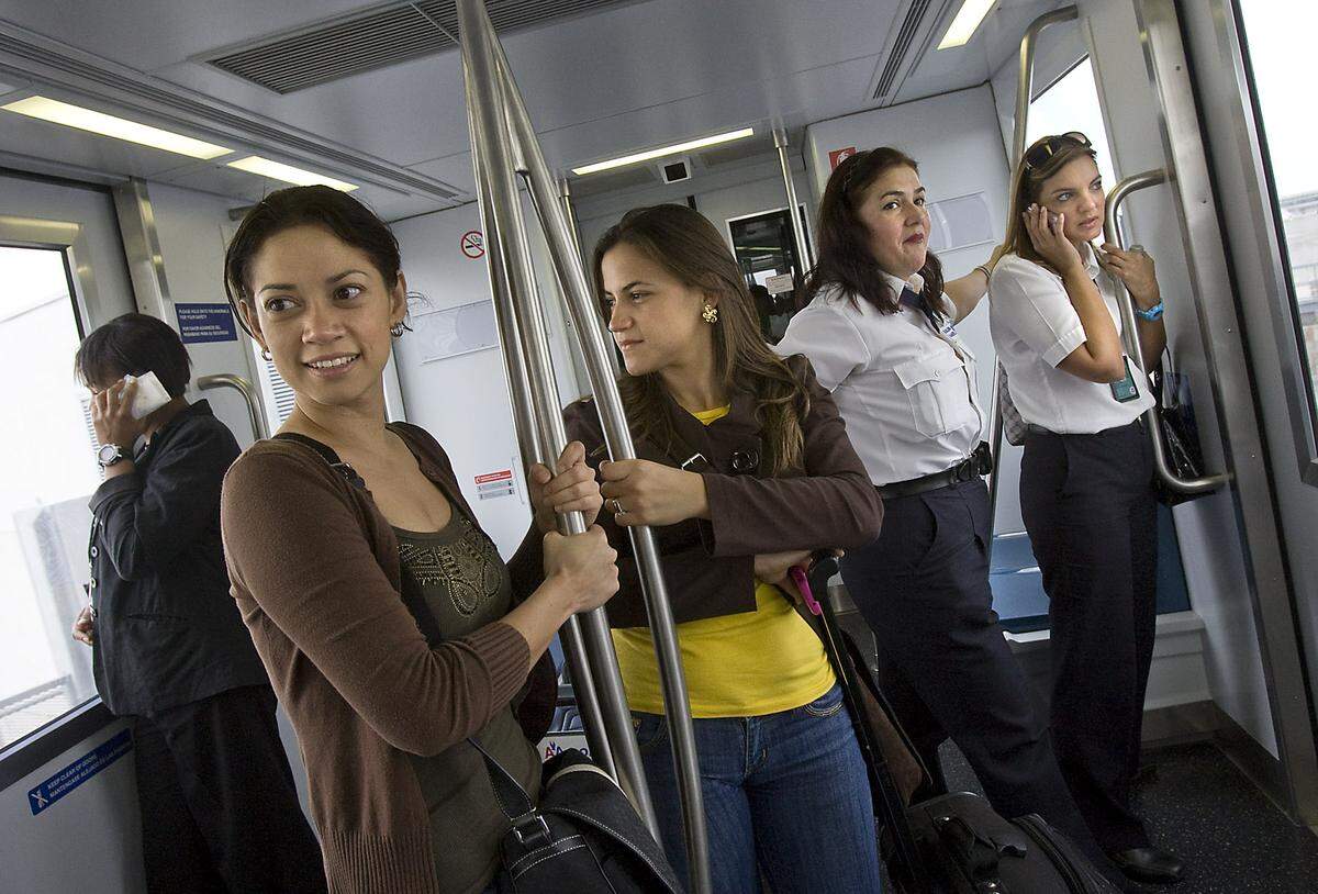 On the first day of Skytrain service in 2010, passengers piled in for a ride at MIA.