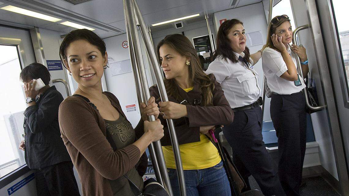 On the first day of Skytrain service in 2010, passengers piled in for a ride at MIA.