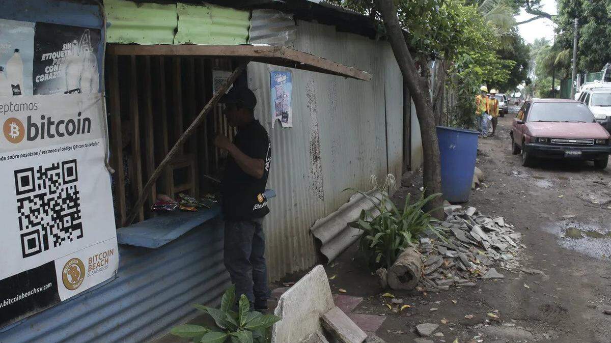 A poster advertises bitcoin along a Salvadoran road. El Salvador has adopted the crypto-currency as legal tender.