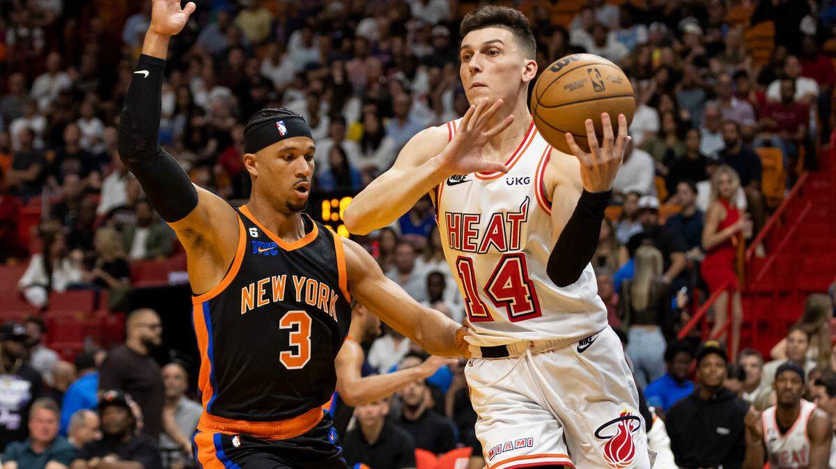 Miami Heat guard Tyler Herro (14) passes as New York Knicks guard Trevor Keels (3) defends during the first quarter of an NBA game at the Miami-Dade Arena on Friday, March 3, 2023, in downtown Miami, Fla.