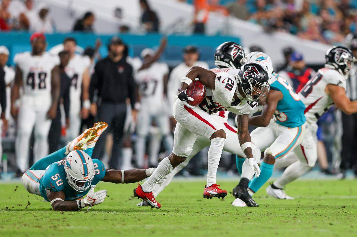 Aug 11, 2023; Miami Gardens, Florida, USA; Atlanta Falcons cornerback Dee Alford (20) runs a punt back for a touchdown against the Miami Dolphins in the fourth quarter at Hard Rock Stadium. Mandatory Credit: Nathan Ray Seebeck-USA TODAY Sports