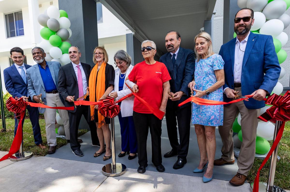 Miami-Dade Mayor Daniella Levine Cava (third from left) at a 2023 ribbon cutting of a redeveloped county housing complex, Robert King High. While her budgets have included slight reductions in property-tax rates, she said residents want Miami-Dade to invest more in services and projects.
