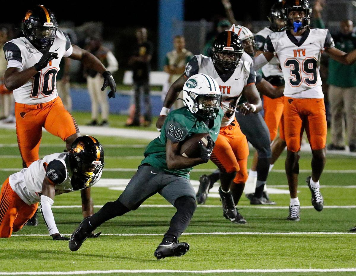 Miami Central Rockets running back Jayden Ford (20) runs to score against Booker T. Washington Tornadoes during the regional semifinal football game on Friday, November 17, 2023 at Traz Powell Stadium in Miami.
