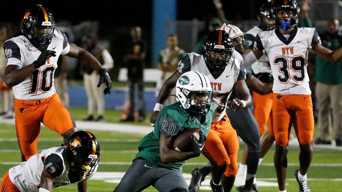 Miami Central Rockets running back Jayden Ford (20) runs to score against Booker T. Washington Tornadoes during the regional semifinal football game on Friday, November 17, 2023 at Traz Powell Stadium in Miami.