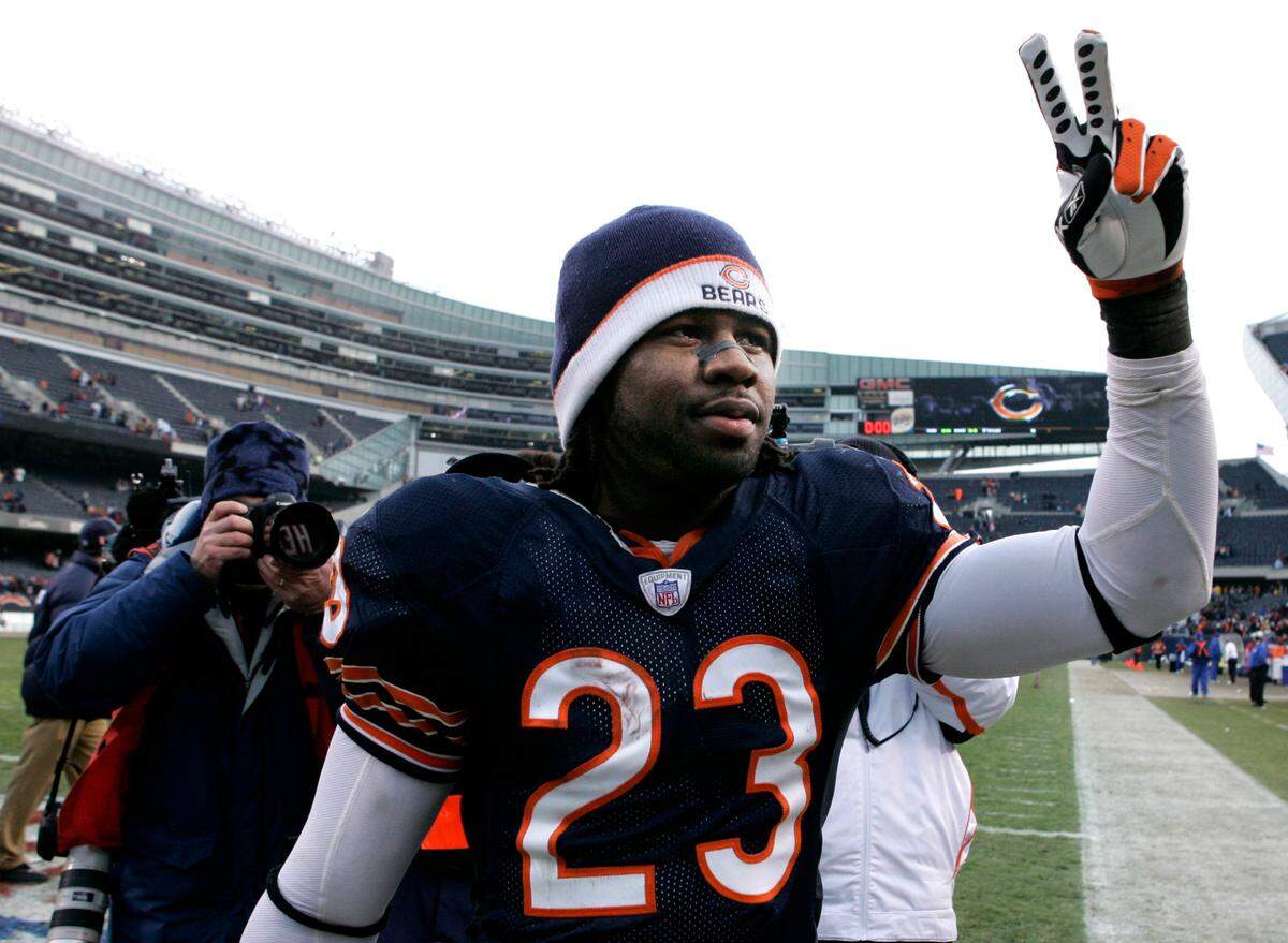Chicago Bears cornerback Devin Hester salutes his fans after his two touchdowns lifted the Bears to a 33-25 win over the New Orleans Saints at Soldier Field in Chicago, Sunday, Dec. 30, 2007. Hester scored on a pass from quarterback Kyle Orton, and a punt return. (AP Photo/Charles Rex Arbogast)