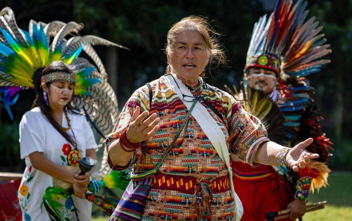 Betty Osceola, center, a Miccosukee tribal activist, with representatives of the Nahuas people, leads a prayer ceremony at the Miami Circle National Historic Landmark in Brickell in support of the designation as an archaeological landmark of nearby 444 Brickell Avenue.