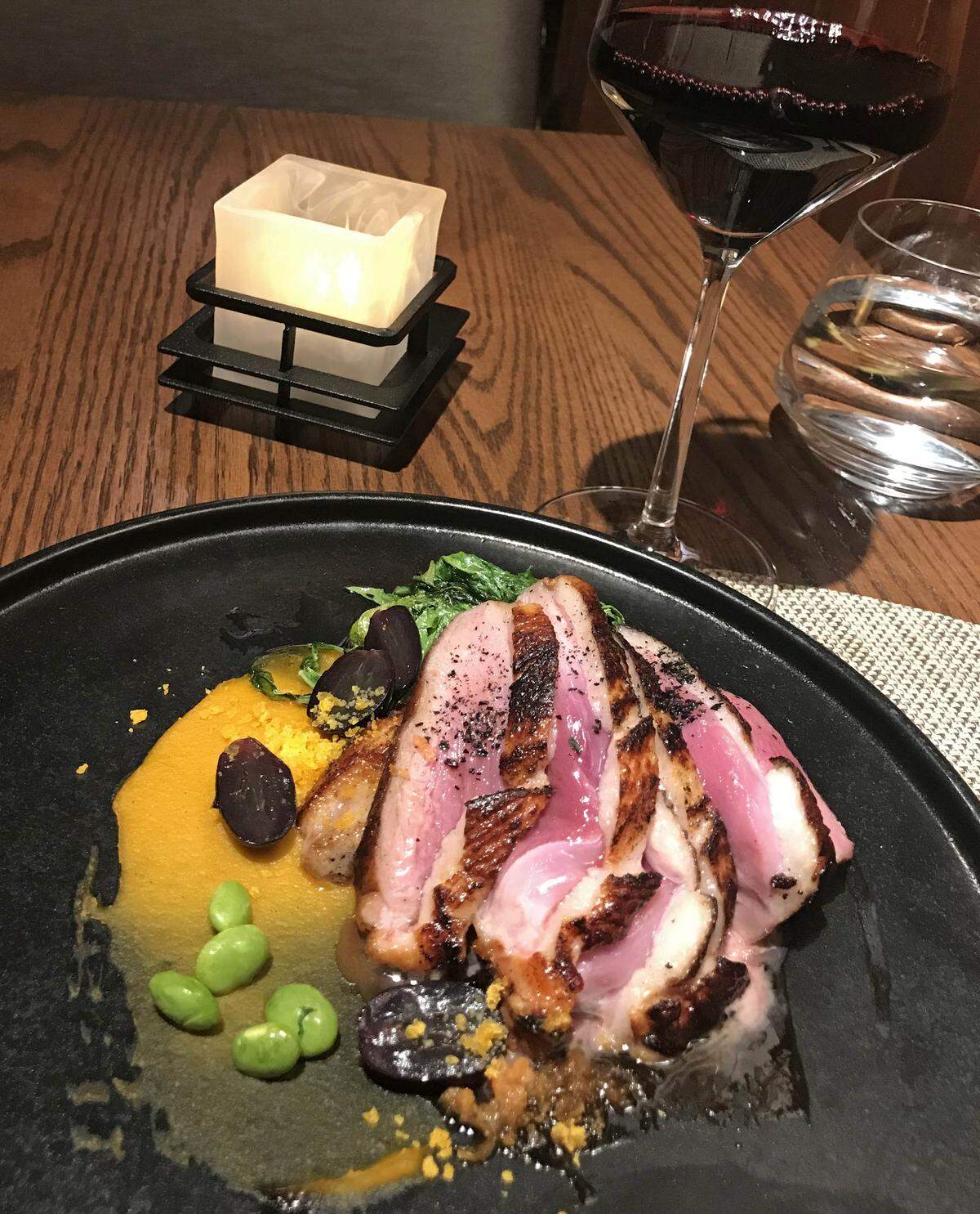 Marinated duck accompanied by kabocha squash and edamame beans is an entree at Takumi Tei, a new Disney signature restaurant in the Japan Pavilion at Epcot.