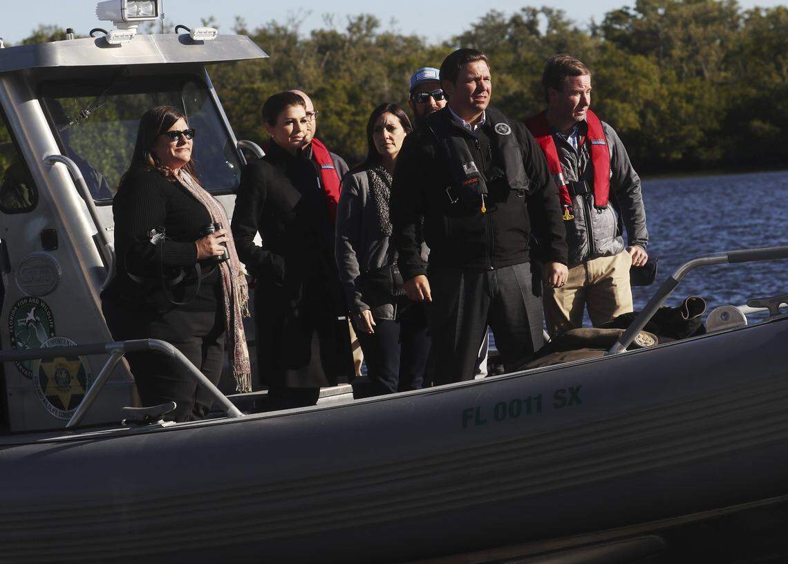 Florida Gov. Ron DeSantis tours the area’s waterways Thursday, Jan. 10, 2019, at Florida Gulf Coast University’s Vester Marine and Environmental Research Field Station in Bonita Springs, Fla., where he signed an executive order addressing problems with algae that have plagued the state.