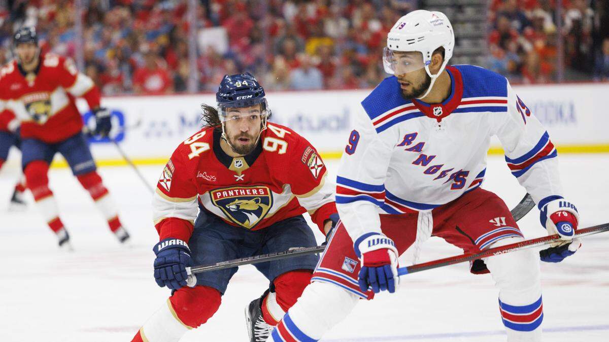 Florida Panthers left wing Ryan Lomberg (94) skates up to New York Rangers defenseman K’Andre Miller (79) during the second period of Game 3 of the Eastern Conference finals of the NHL hockey Stanley Cup playoffs at the Amerant Bank Arena on Sunday, May 26, 2024, in Sunrise, Fla.