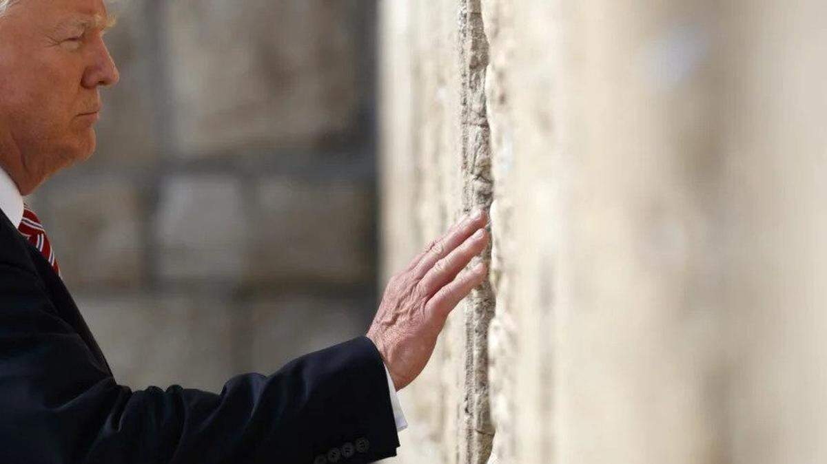 President Trump reaches out to touch the Western Wall during his visit to Jerusalem in May 2017.
