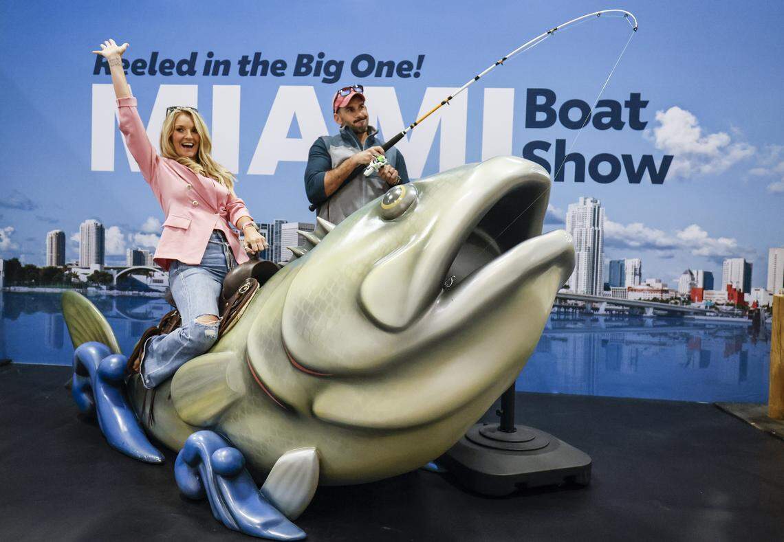 Kayla and Mark Hotze of Destin, Florida pose at a photo booth on display at the Miami Beach International Boat Show in the Miami Beach Convention Center on Miami Beach, FL, on Thursday, February 12, 2026 
