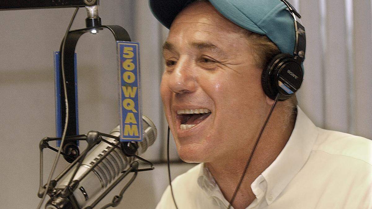 In this file photo from Aug. 4, 2005, .Jim Mandich works the mic during his sports-talk radio show on WQAM. The Miami Dolphins tight end played the 1972 Perfect Season and the Dolphins Cancer Challenge cycling event has been a South Florida mainstay for 16 years in tribute to his memory and as a fundraiser to combat cancer.