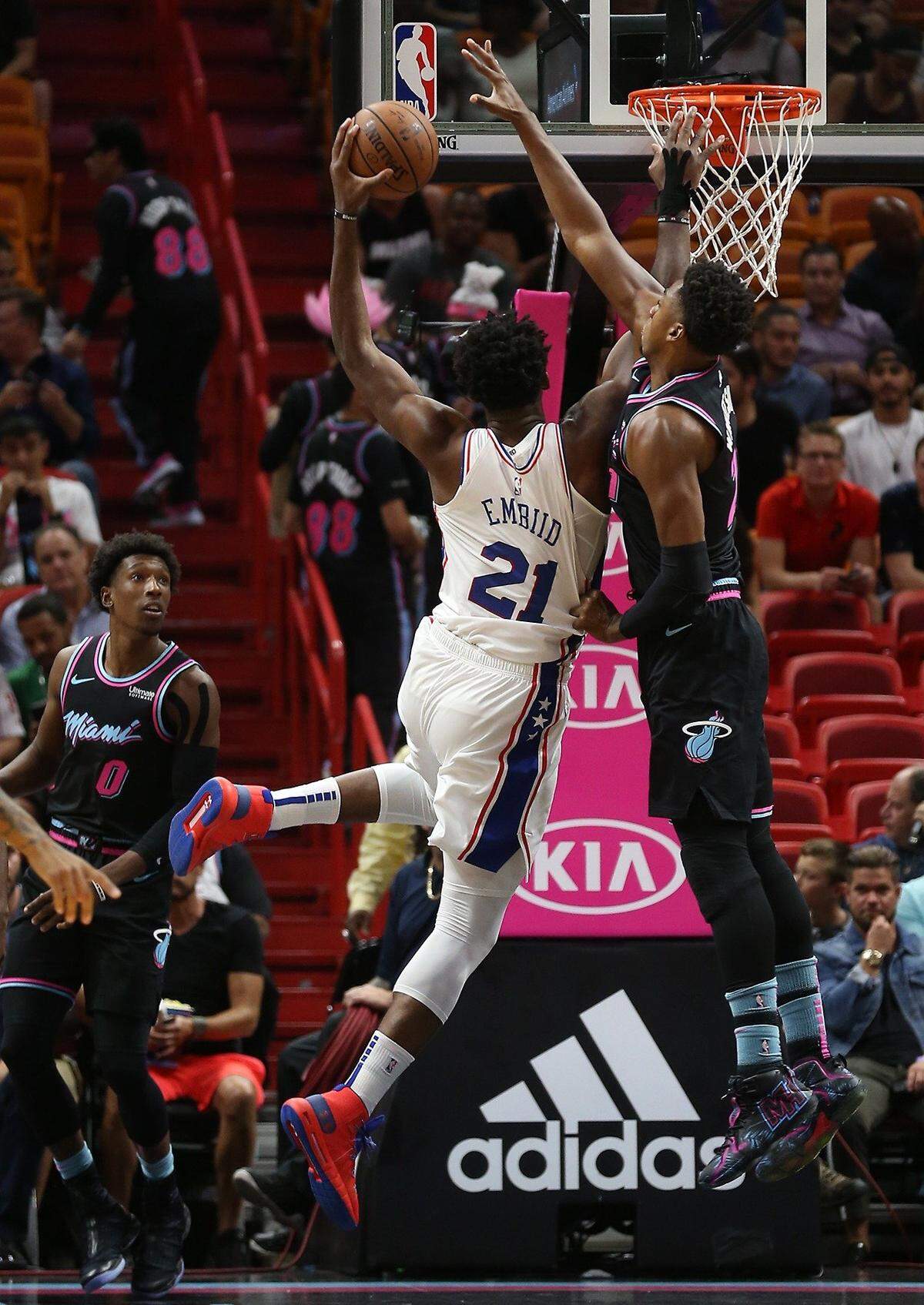 The Heats #21 Hassan Whiteside blocks a shot by the 76ers #21 Joel Embiid in the first quarter as the Miami Heat host the Philadelphia 76ers on Monday, November 12, 2018.