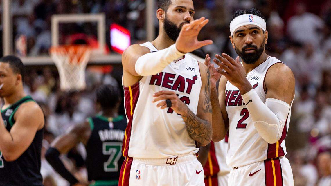 Miami Heat point guard Gabe Vincent (2) interacts with teammate Caleb Martin (16) during Game 3 of the NBA Eastern Conference Finals series against the Boston Celtics at Kaseya Center in Miami, Florida, on May 21, 2023.