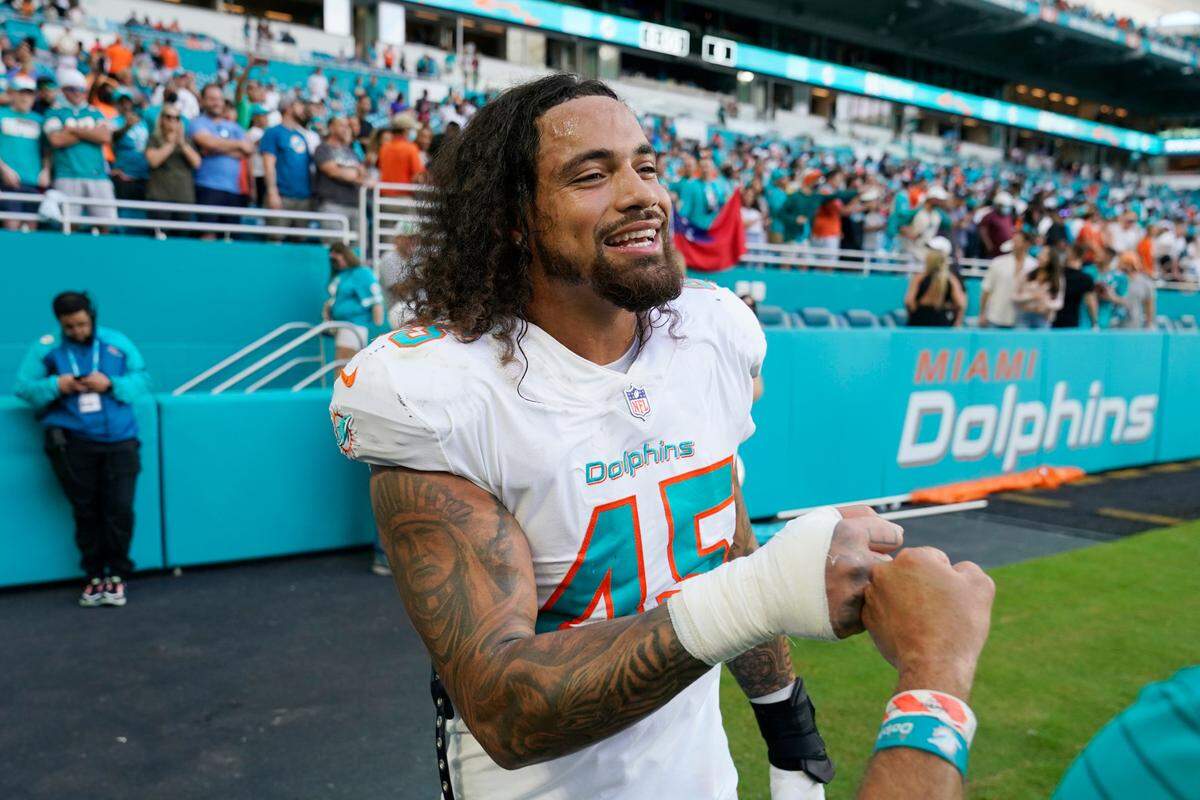 Miami Dolphins outside linebacker Duke Riley (45) celebrates at the end of an NFL football game against the Carolina Panthers, Sunday, Nov. 28, 2021, in Miami Gardens, Fla. The Dolphins defeated the Panthers 33-10. (AP Photo/Wilfredo Lee)
