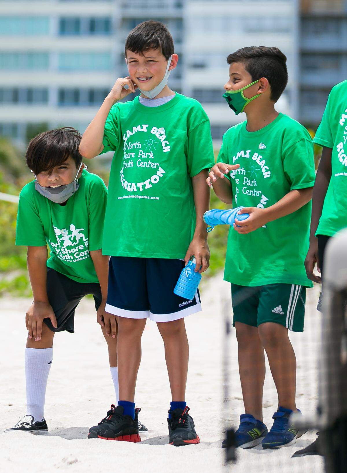 Children from the North Shore Youth Center watch as a rehabilitated brown pelican is released by the Pelican Harbor Seabird Station in Miami Beach, Florida on Tuesday, June 22, 2021. The station released two rehabilitated brown pelicans into the wild Tuesday.