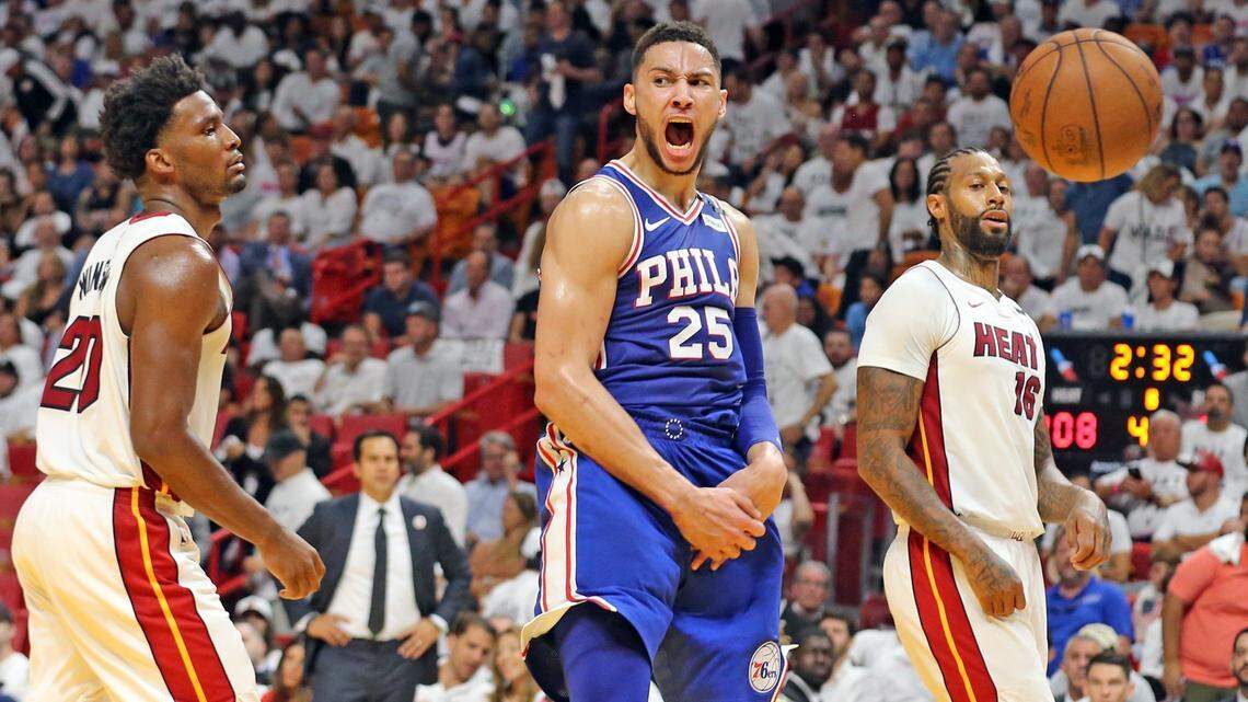 The Miami Heat's Justise Winslow (20) and James Johnson (16) watch as the Philadelphia 76ers Ben Simmons (25) screams after a dunk in the fourth quarter in Round 1, Game 3, at the AmericanAirlines Arena in Miami, Florida, April 19, 2018.