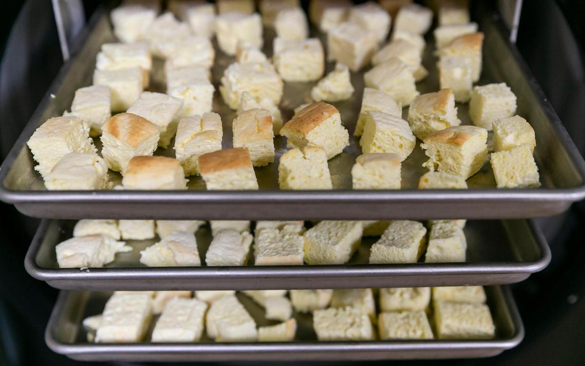 Jenifer Shwartz, 36, the creator of Freezcake, shows trays of her freeze-dried cheesecake snack at her bakery in Hollywood, Florida, on Wednesday, April 27, 2022.
