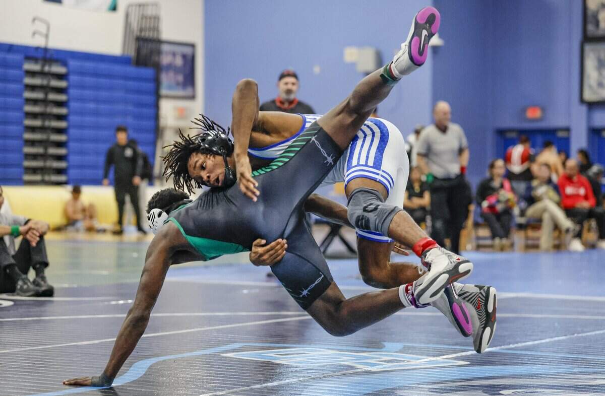 South Dade High's Tyree Graham wrestles Miami Central High's Ibrahim Gowon during the GMAC Boys Wrestling Championships at South Dade Senior High School in Homestead, Florida on Friday, February 6, 2026.