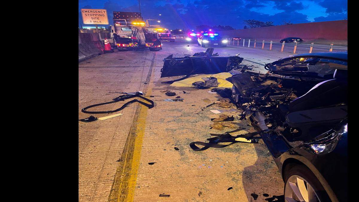 An early morning crash Wednesday, May 19, between a black Tesla and a Road Ranger truck left debris scattered on the interstate.