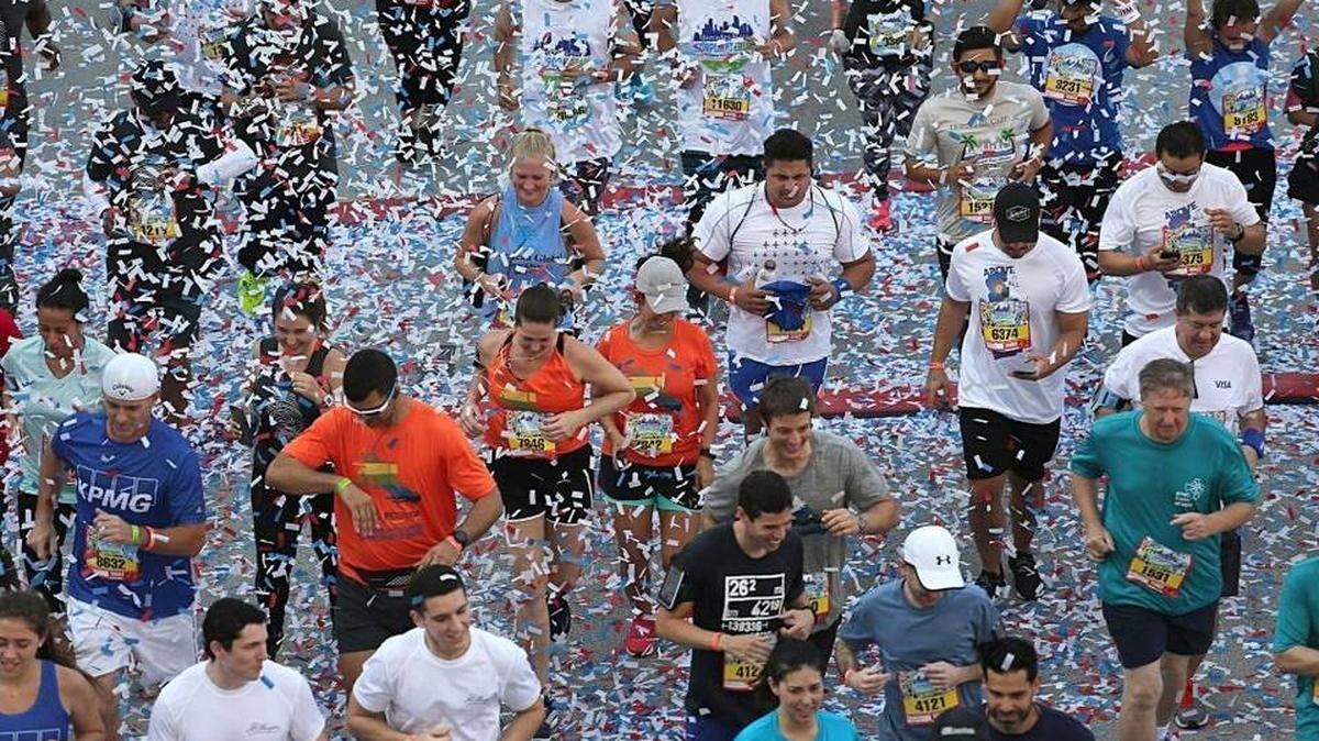 On Thurs., April 27, 2017 confetti rains down on more than 28,000 runners during the start of the 33rd Mercedes-Benz Miami Corporate Run in downtown Miami's Bayfront Park.
