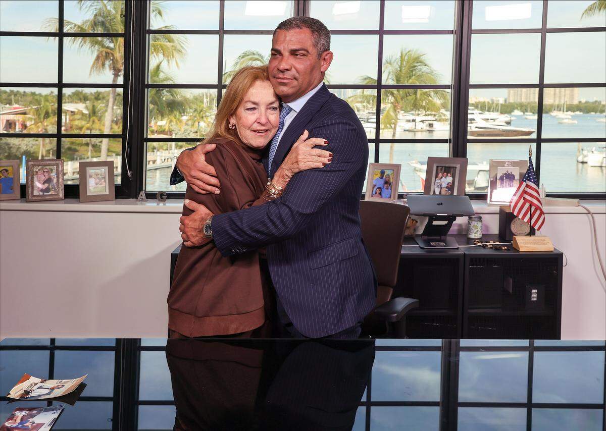 After his last Miami City Commission meeting, Mayor Francis X. Suarez gets a office visit by his mother, Rita Suarez, left, as they reflect on his and father's legacy as Francis began the moving process from the mayor's office that he and his father, former Mayor Xavier Suarez, once occupied on Thursday, December 11, 2025, at City Hall in Miami, Florida.