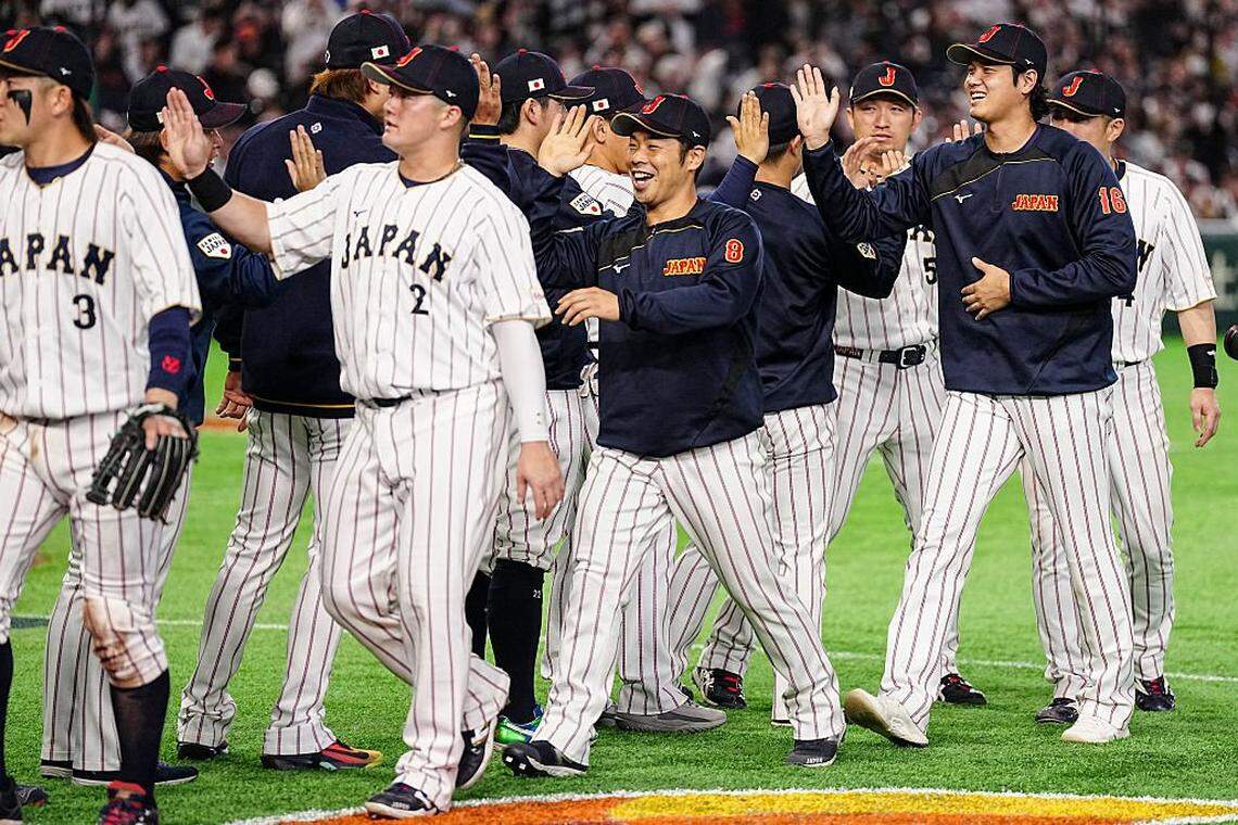 Japan players including Shohei Ohtani (R) celebrate their victory in the World Baseball Classic (WBC) Pool C game between Japan and Czech Republic at the Tokyo Dome in Tokyo on March 10, 2026. (Photo by Yuichi YAMAZAKI / AFP via Getty Images)