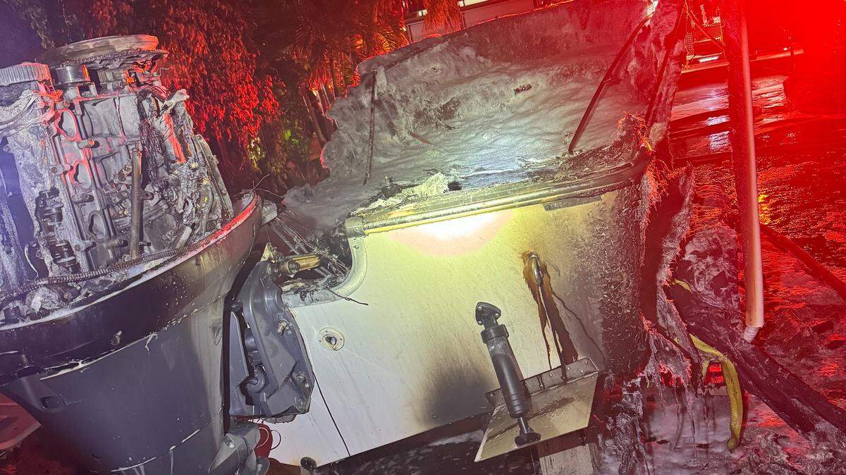 A charred boat is parked on a trailer in front of a house in the Middle Florida Keys city of Marathon Wednesday morning, Sept. 3, 2025.