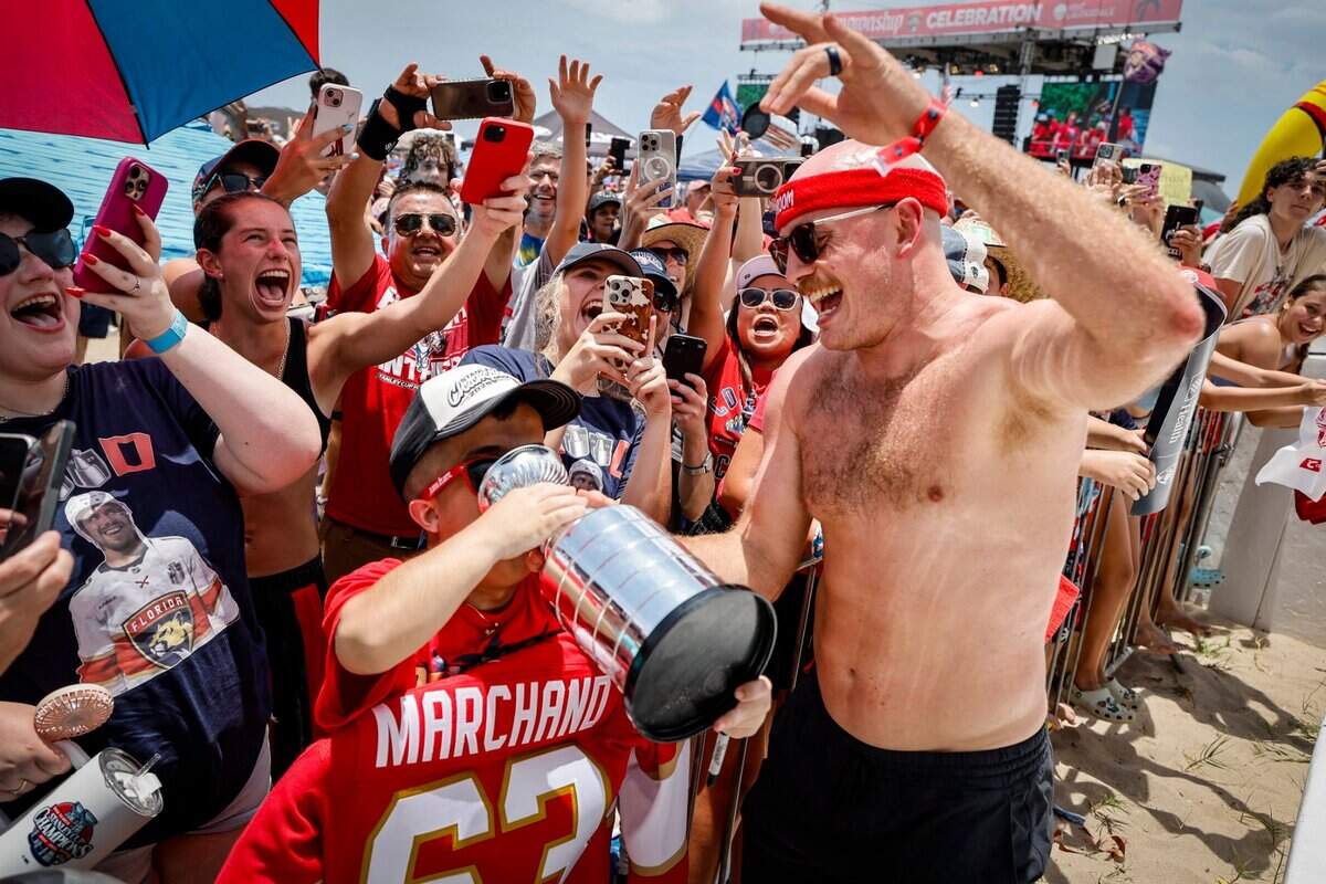 Florida Panthers defenseman Nate Schmidt interacts with a fan during the Florida Panthers Stanley Cup victory parade and rally at the beach along A1A in Fort. Lauderdale, Florida on Sunday, June 22, 2025.