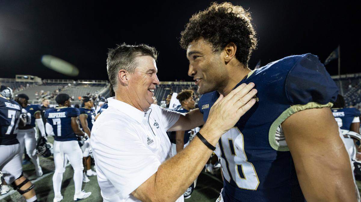 FIU Panthers head coach Mike MacIntyre celebrates tight end Josiah Miamen (88) after defeating the Central Michigan Chippewas in their NCAA DI football game at Pitbull Stadium on Saturday, Sept. 7, 2024, in Miami, Fla.