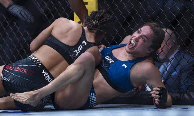 Tatiana Suarez of the United States reacts after defeating Loopy Godinez of Mexico in their strawweight bout at UFC 327 at the Kaseya Center on Saturday, April 11, 2026, in downtown Miami, Fla.