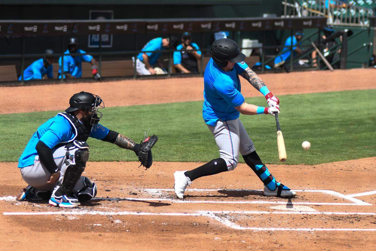 Miami Marlins outfielder Peyton Burdick swings at a pitch during a live batting practice session on Saturday, Feb. 27, 2021, at Roger Dean Chevrolet Stadium in Jupiter, Florida.