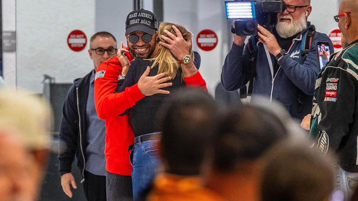 Miami Proud Boys leader Enrique Tarrio hugs his mother Zuny Duarte as he arrives at Miami International Airport Wednesday, Jan. 22, 2025, after being released from a federal prison after President Donald Trump issued an executive order Monday.