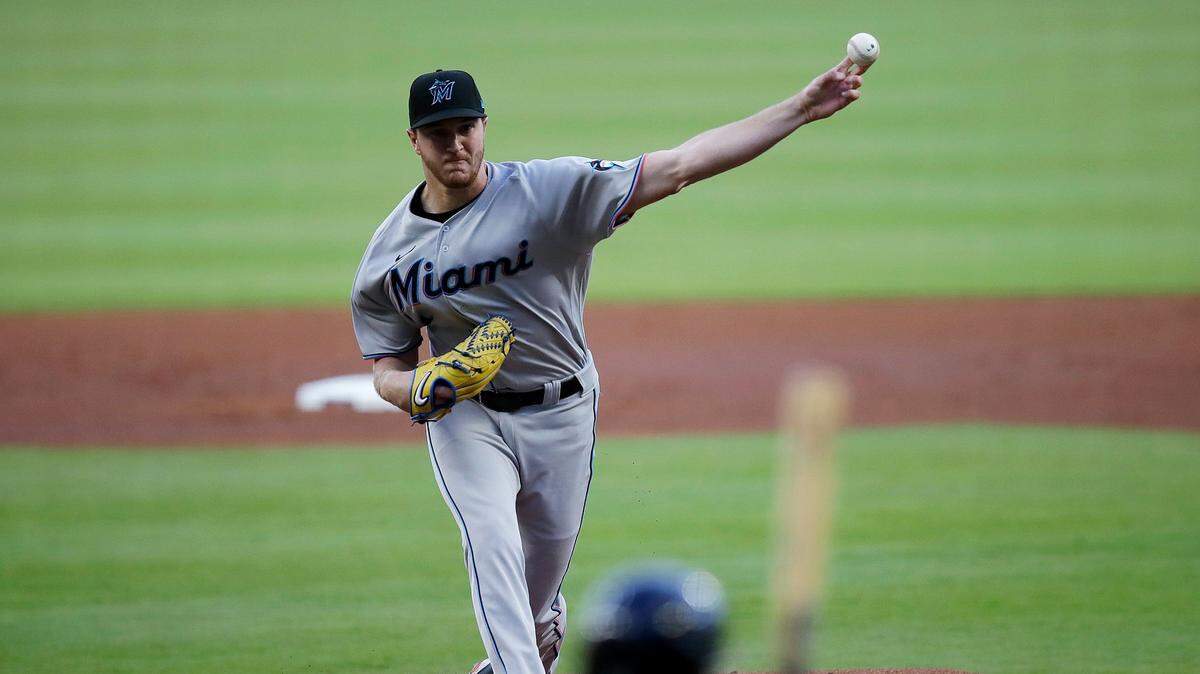 Miami Marlins’ Trevor Rogers pitches to Atlanta Braves’ Ozzie Albies during the first inning of a baseball game Friday, April 22, 2022, in Atlanta.