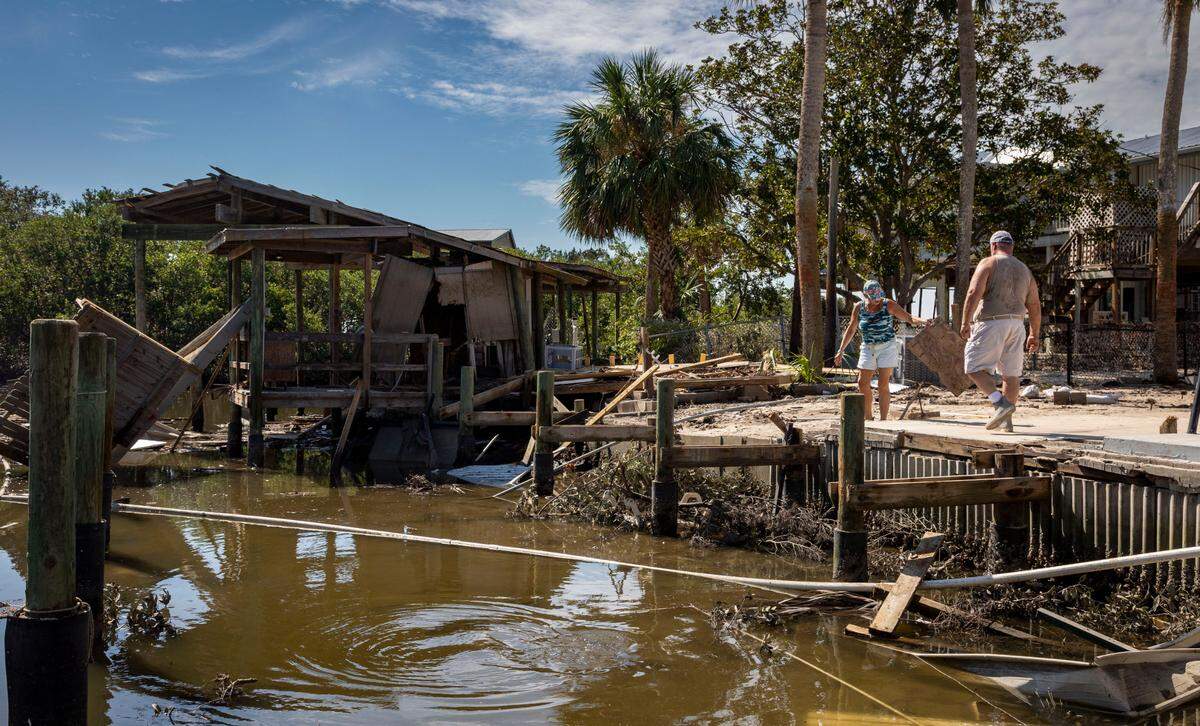 Jeff and Laurie Schleede spent days cleaning their property on Cedar Key, which was gutted by Helene. The storm also took out their dock.