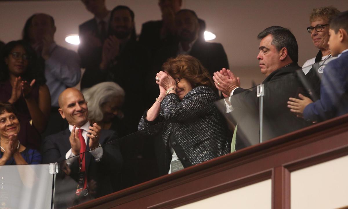 Carmen Oliva, center, mother of new Florida House Speaker José Oliva, R-Miami Lakes, reacts during her son’s speech about his family. He talked about his parents’ dedication to the family and their early struggles.