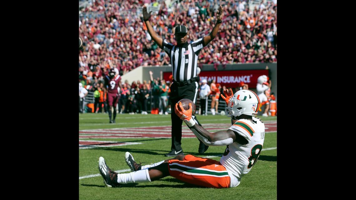 Miami wide receiver Colbie Young (88) celebrates catching a touchdown pass during the first half during the first half of an NCAA football game against Virginia Tech, Saturday Oct. 15 2022, in Blacksburg Va. (Matt Gentry/The Roanoke Times via AP)