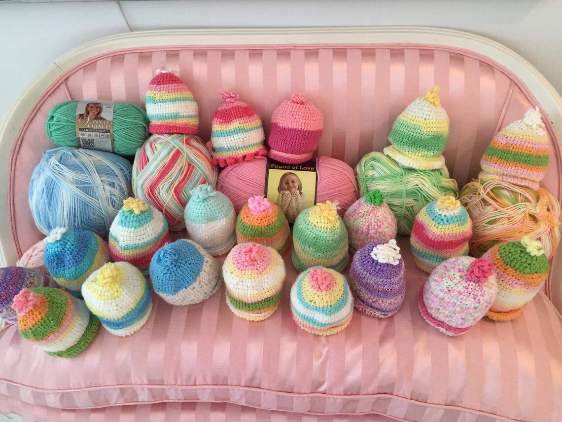 Some of the hats Mazie Ford crocheted for the newborns at Memorial Healthcare.