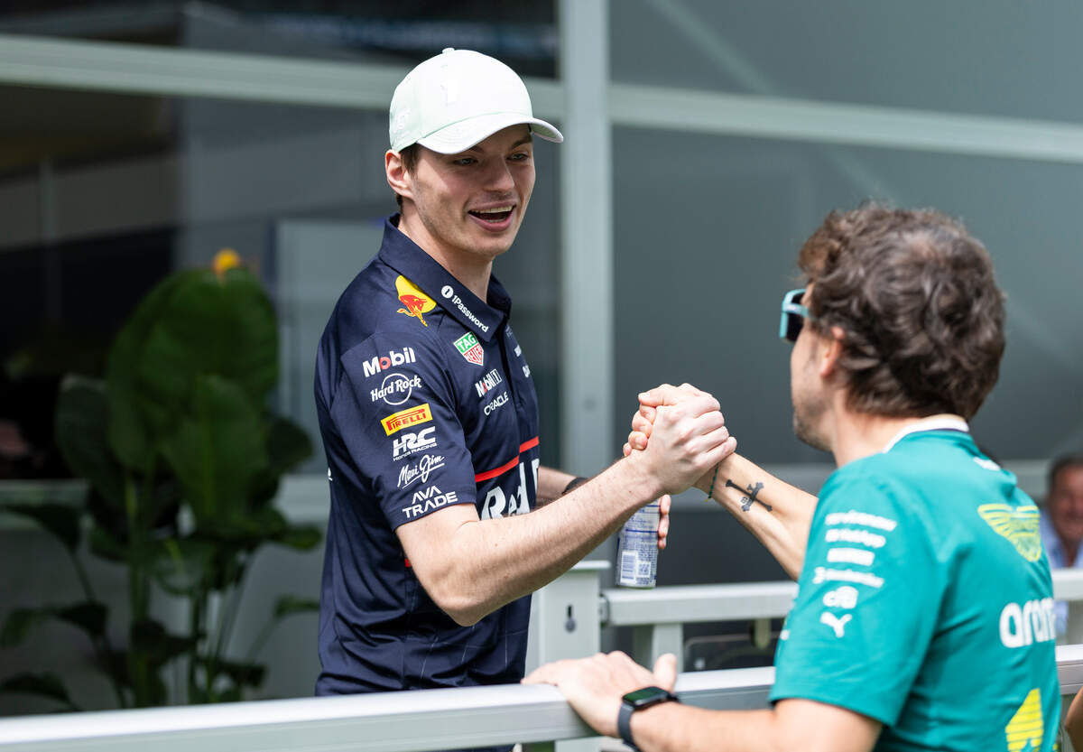 Red Bull Racing driver Max Verstappen of Netherlands shakes hands with Aston Martin driver Fernando Alonso of Spain as they arrive to the Miami International Autodrome ahead of a practice session on the first day of the Formula One Miami Grand Prix on Friday, May 2, 2025, in Miami Gardens, Fla.