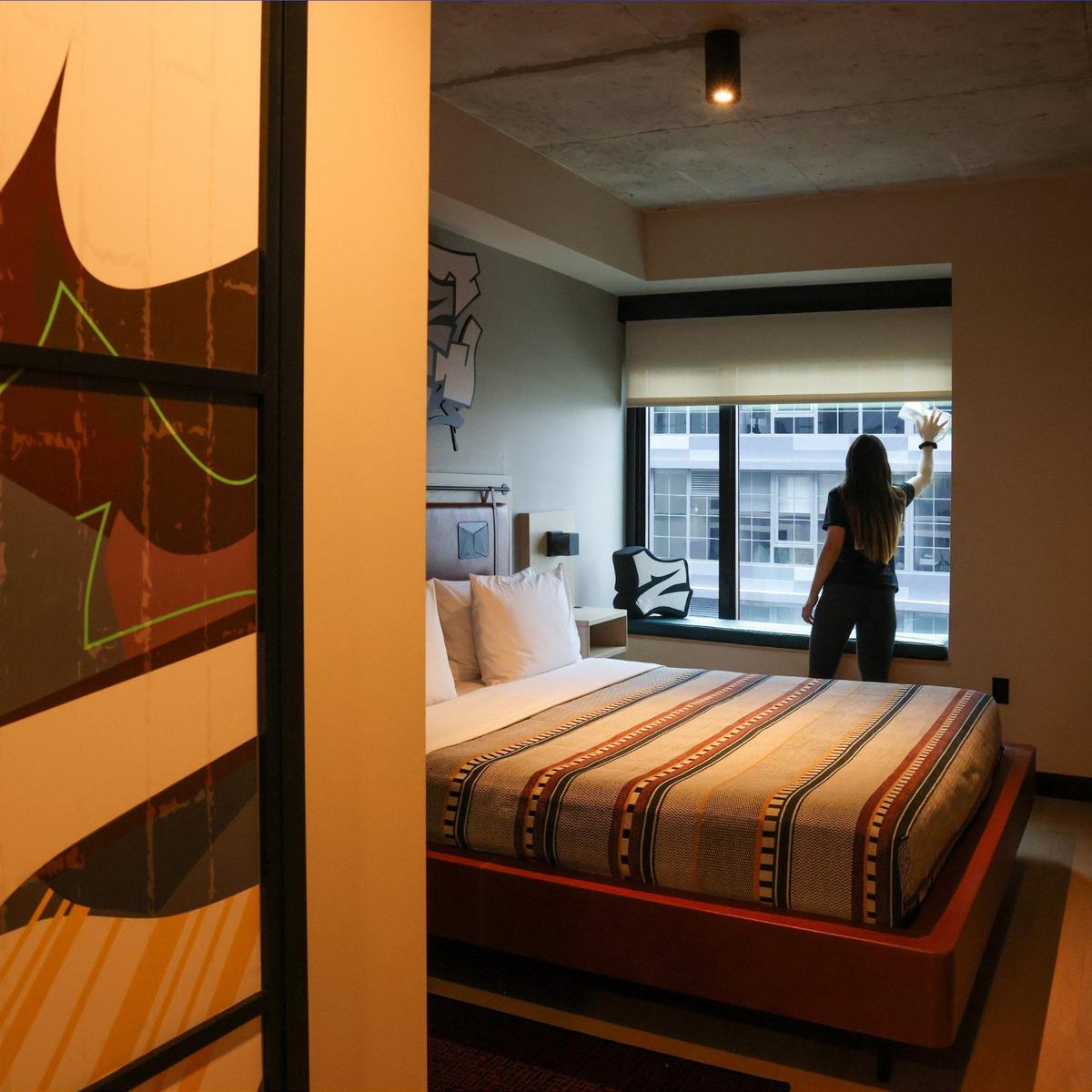Moxy Miami Wynwood Hotel is close to opening its new location in Miami’s trendy Wynwood Art District. Hotel housekeeper Maria Gonzalez, preps the room with a king bed on Monday, July 29, 2024, in Miami, Florida. The Moxy Hotel features a colorful designs and decor to reflect Wynwood’s artistic and creative spirit, a second-level bar that doubles as a Check-In desk, stylish communal spaces, and innovative touches that create a fun and contemporary ambiance.
