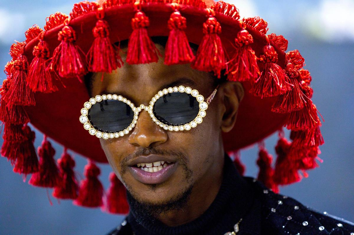 Recent Miami transplant Phree Hester socializes during the Preview for The Art of Transformation event at The ARC and Logan Building in Opa-locka, Florida, on Wednesday, November 30, 2022. The event is a five-day, three-block Mecca of African and Haitian art fair coinciding with Art Basel Miami Beach 2022 and just one of over 40 ‘exhibits’ part of 2022 Art of Black Miami.