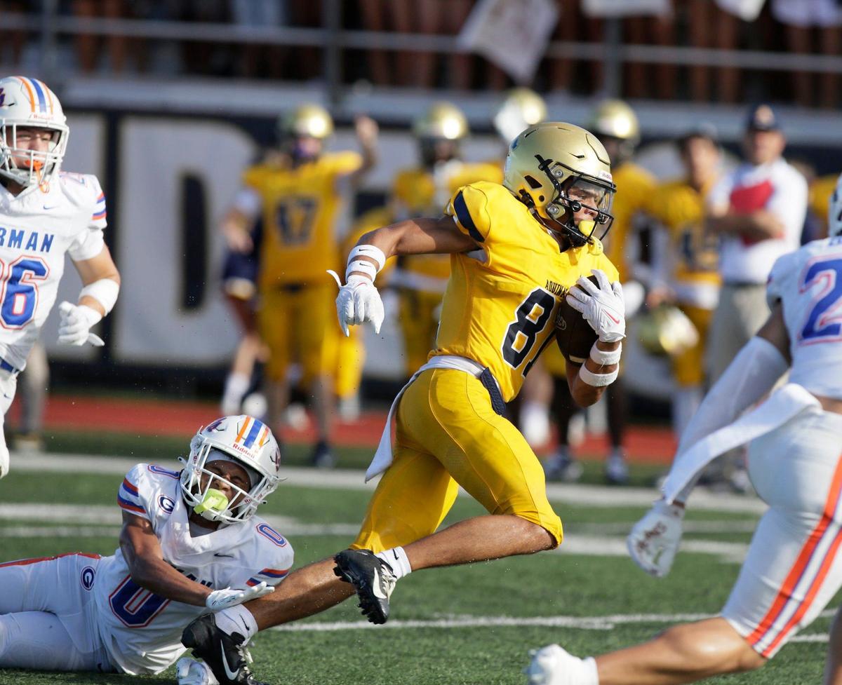 St. Thomas Aquinas wide receiver Julius Jones (81) breaks free from Las Vegas Bishop Gorman defender during football game on Saturday, August 24, 2024 at St. Thomas Aquinas HS in Fort Lauderdale. Andrew Uloza / for Miami Herald