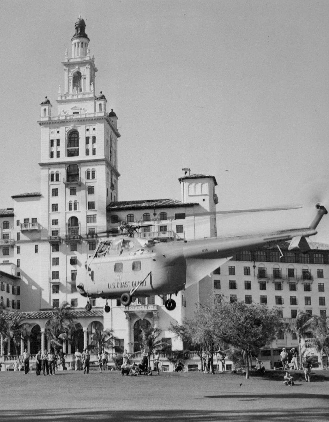 A Coast Guard helicopter makes an emergency landing on the 1th green of the Biltmore golf course in 1952.