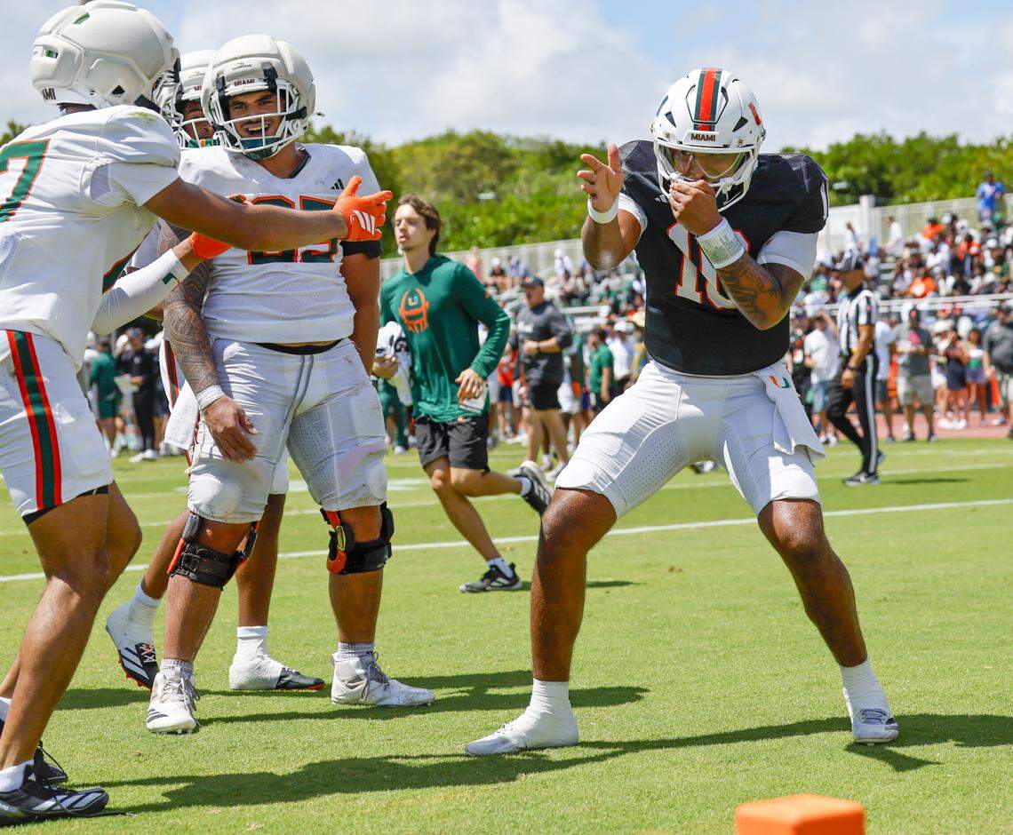Miami Hurricanes quarterback Darian Mensah (10) and wide receiver Cam Vaughn (17) celebrate after Vaughn scores on a pass from Mensah during UM’s spring football game at Cobb Stadium on the University of Miami campus in Coral Gables, Florida, on Saturday, April 18, 2026.