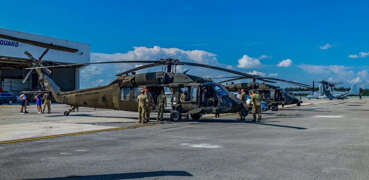 Military crews and pilots prepare to depart from the U.S. Coast Guard Air Station in Opa-locka for a practice flight over South Beach, ahead of the Hyundai Air & Sea Show’s return to Miami Beach for the annual National Salute to America’s Heroes on Friday, May 23, 2025.